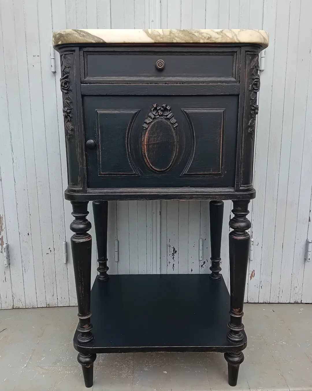 Romantic black bedside table with patinated marble and wood