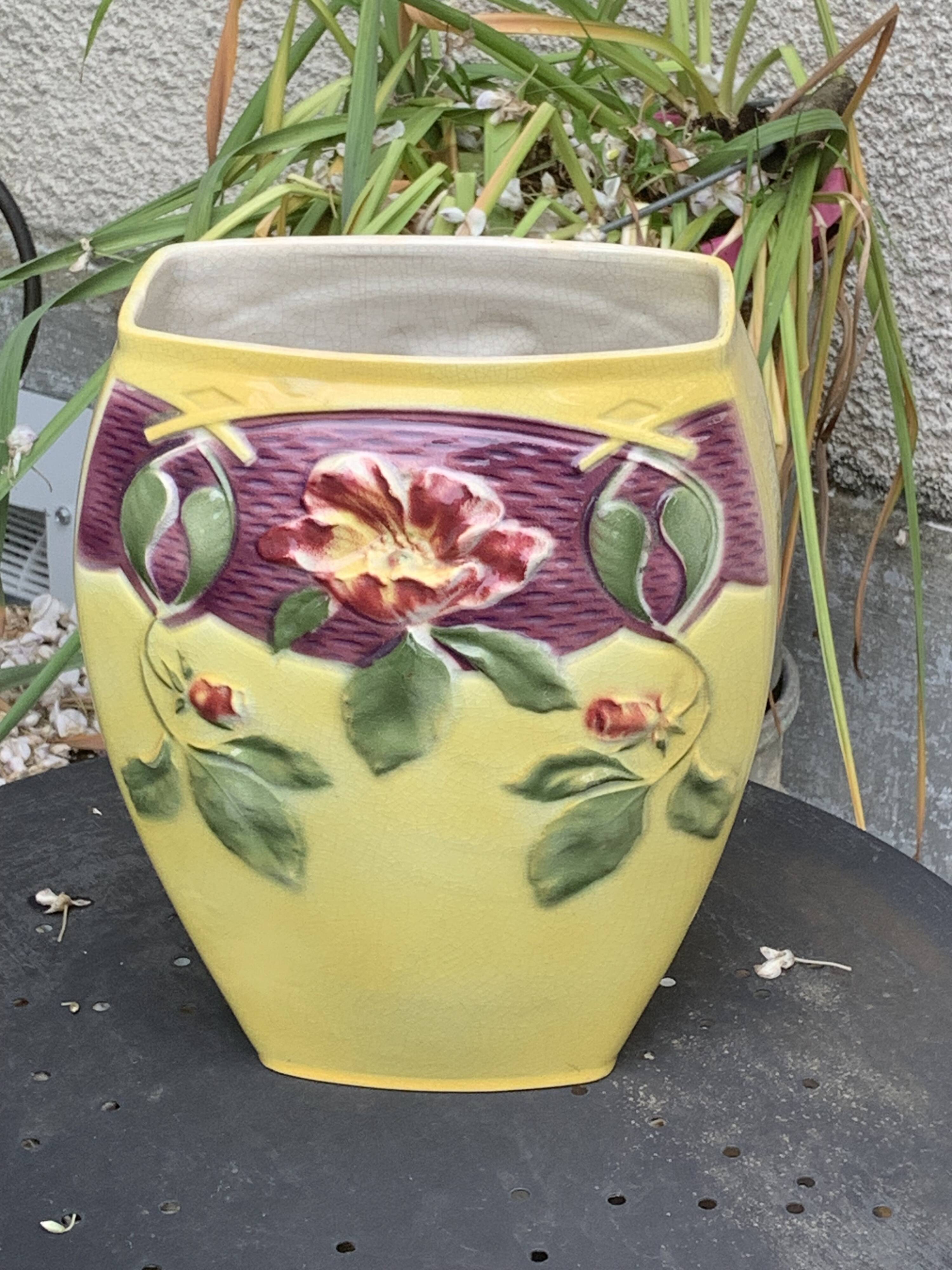 Yellow glazed ceramic slip vase with hawthorn pink flower motif