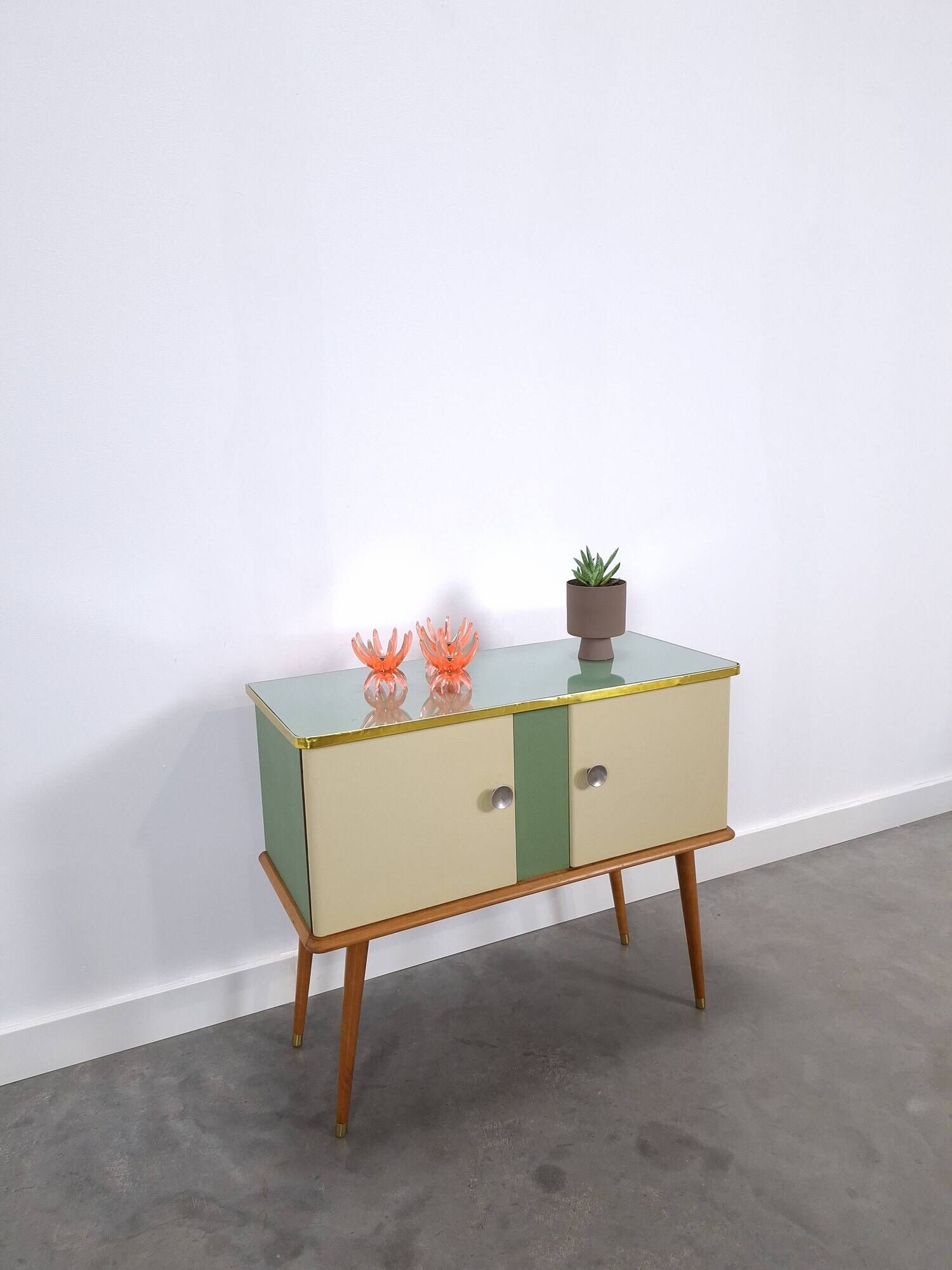 Vintage green DDR cabinet, model Libelle with glass top, slanted legs.