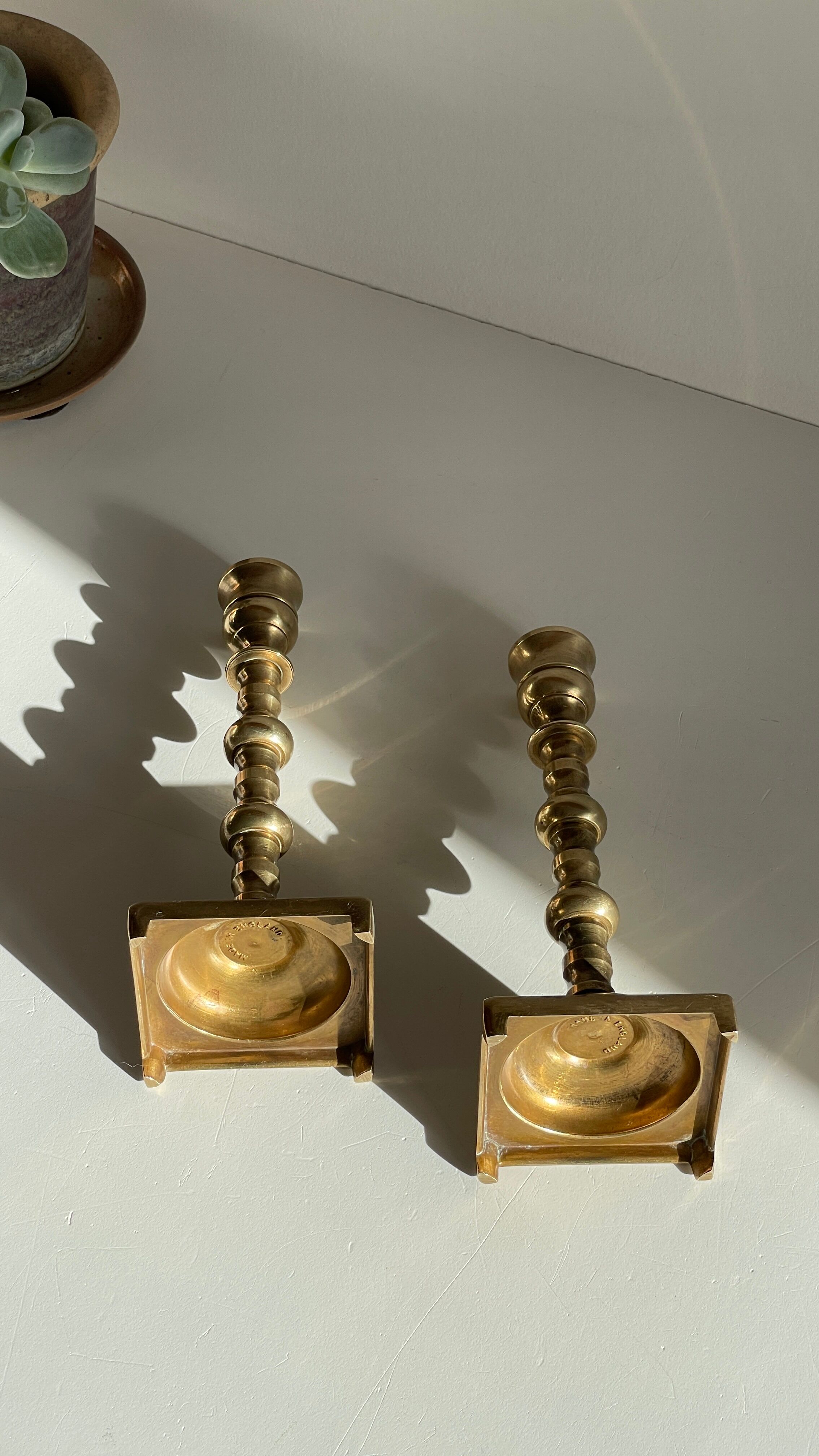 Pair of brass candle holders made in England