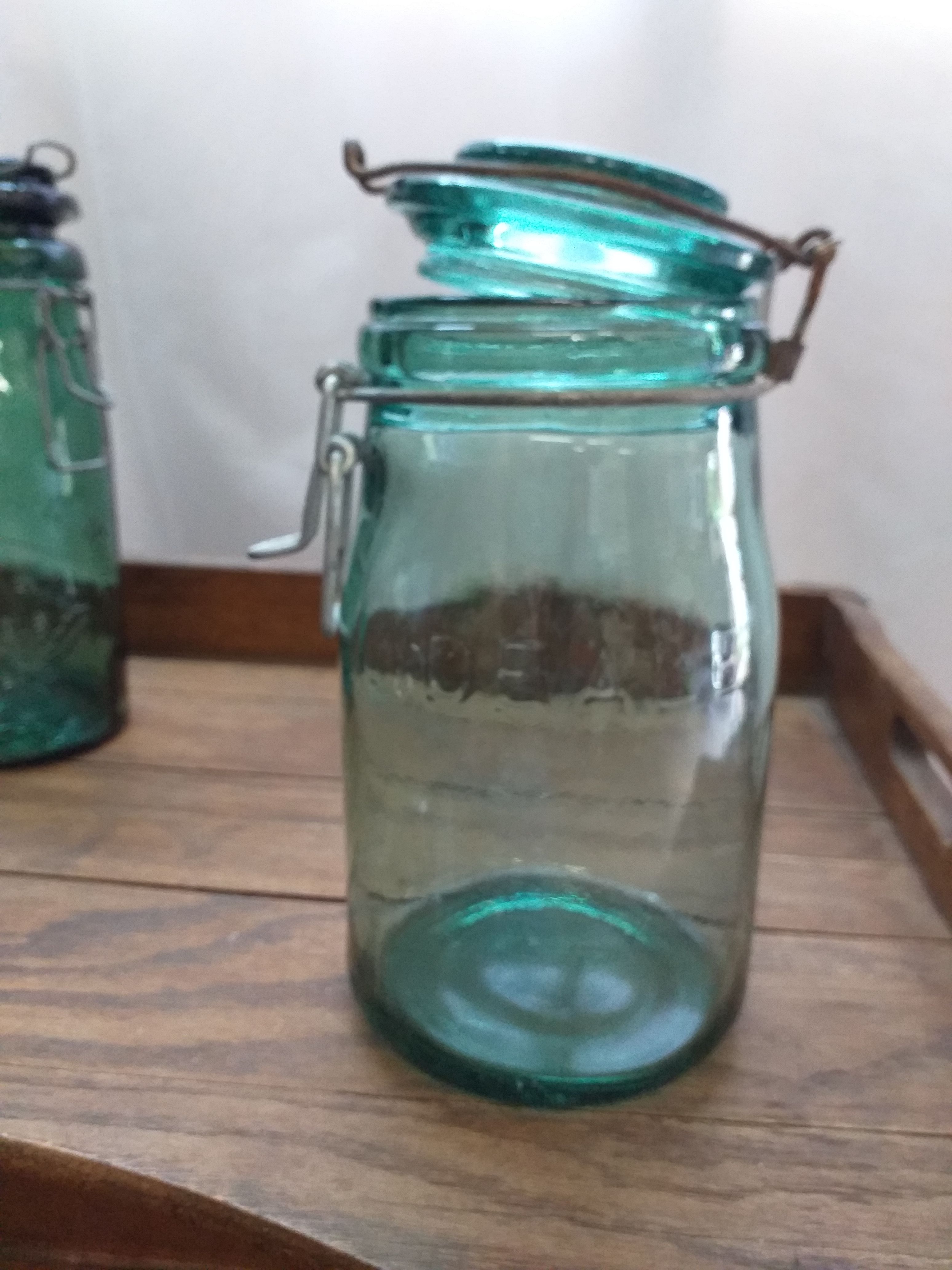 Old jar La Lorraine and The ideal in thick glass light green and dark green