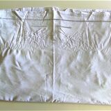 Old openwork sheet embroidered with 2 flowers and a butterfly