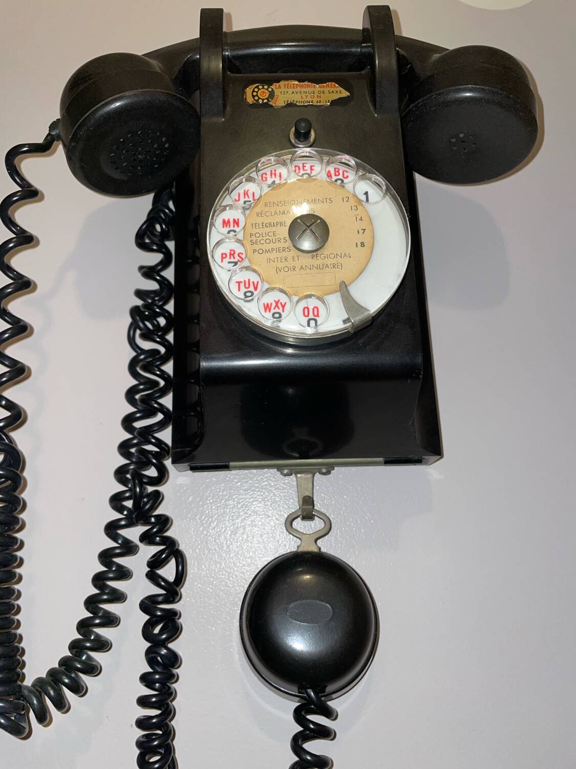 Old Ericsson wall telephone in black bakelite