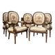 Suite de cinq fauteuils à dossier médaillon de style Louis XVI
