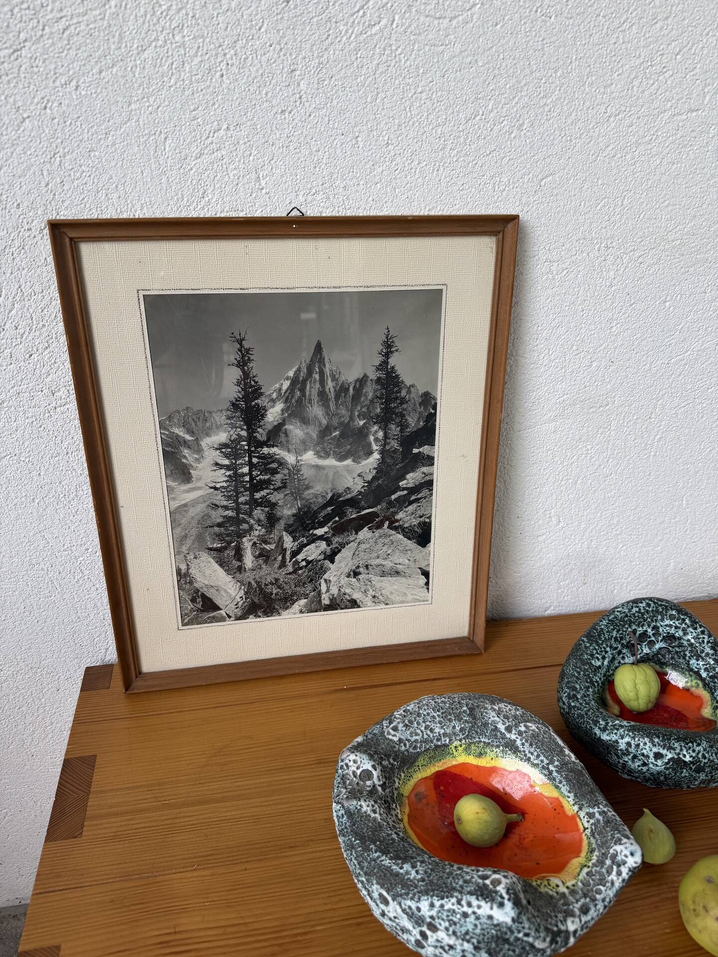 Framed old photo of a mountain landscape.