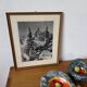 Framed old photo of a mountain landscape.