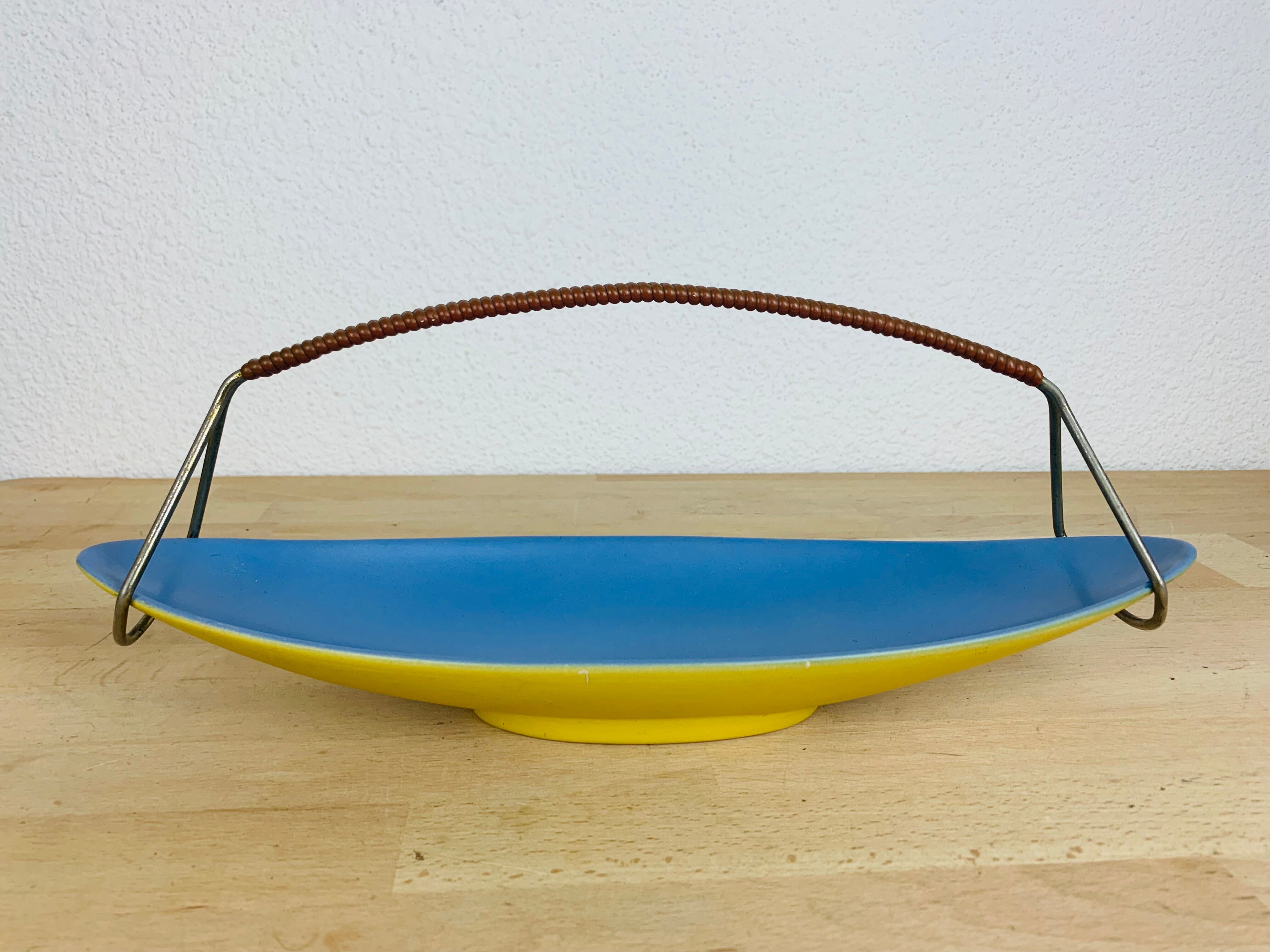 Empty ceramic shuttle pocket from the 50s