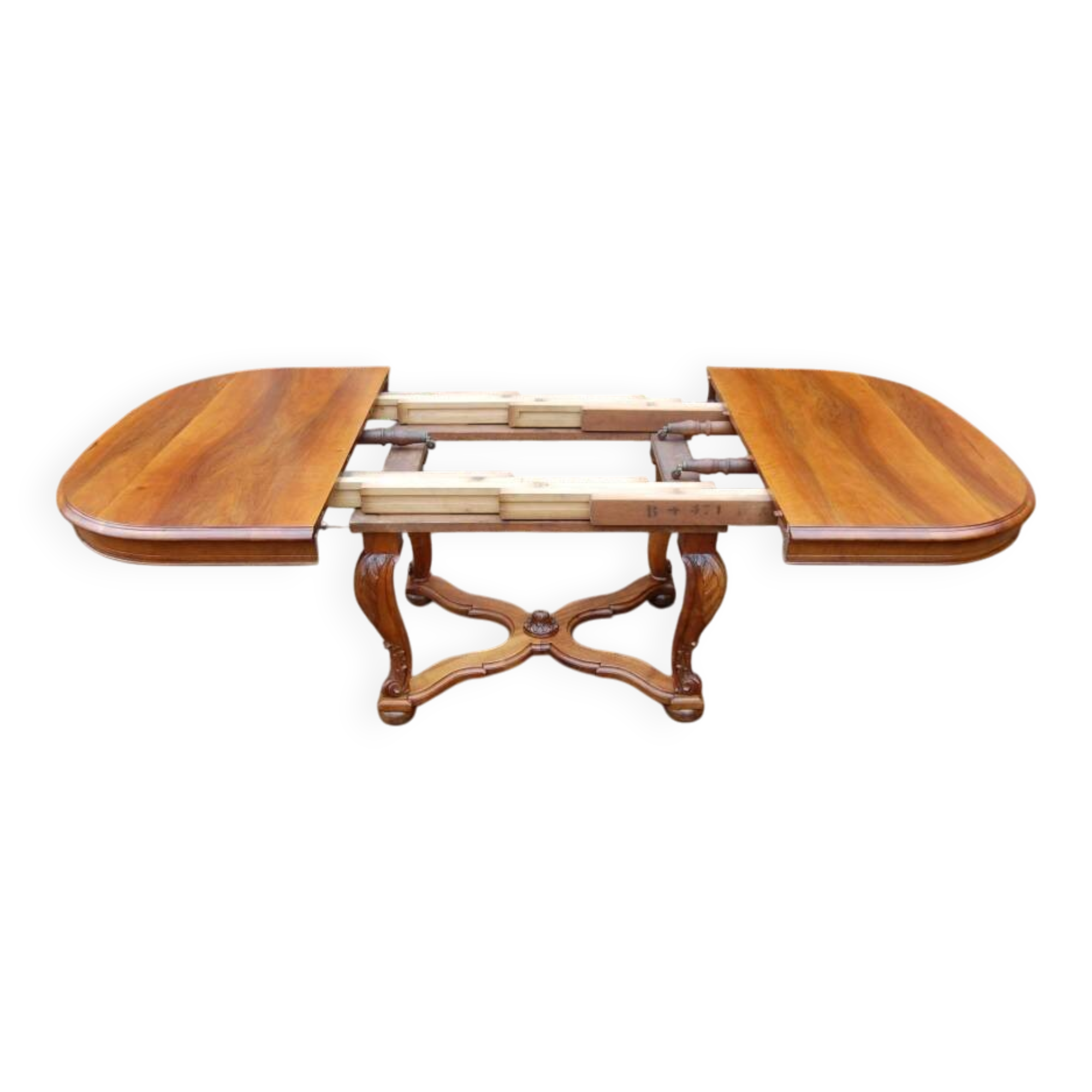Napoleon III period walnut table from the late 19th century with extensions for 16 covers.