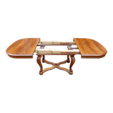 Napoleon III period walnut table from the late 19th century with extensions for 16 covers.