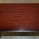Small console with two drawers in hardwood finish.