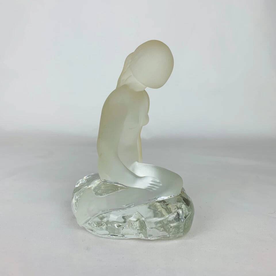 Vintage moulded glass mermaid sculpture.