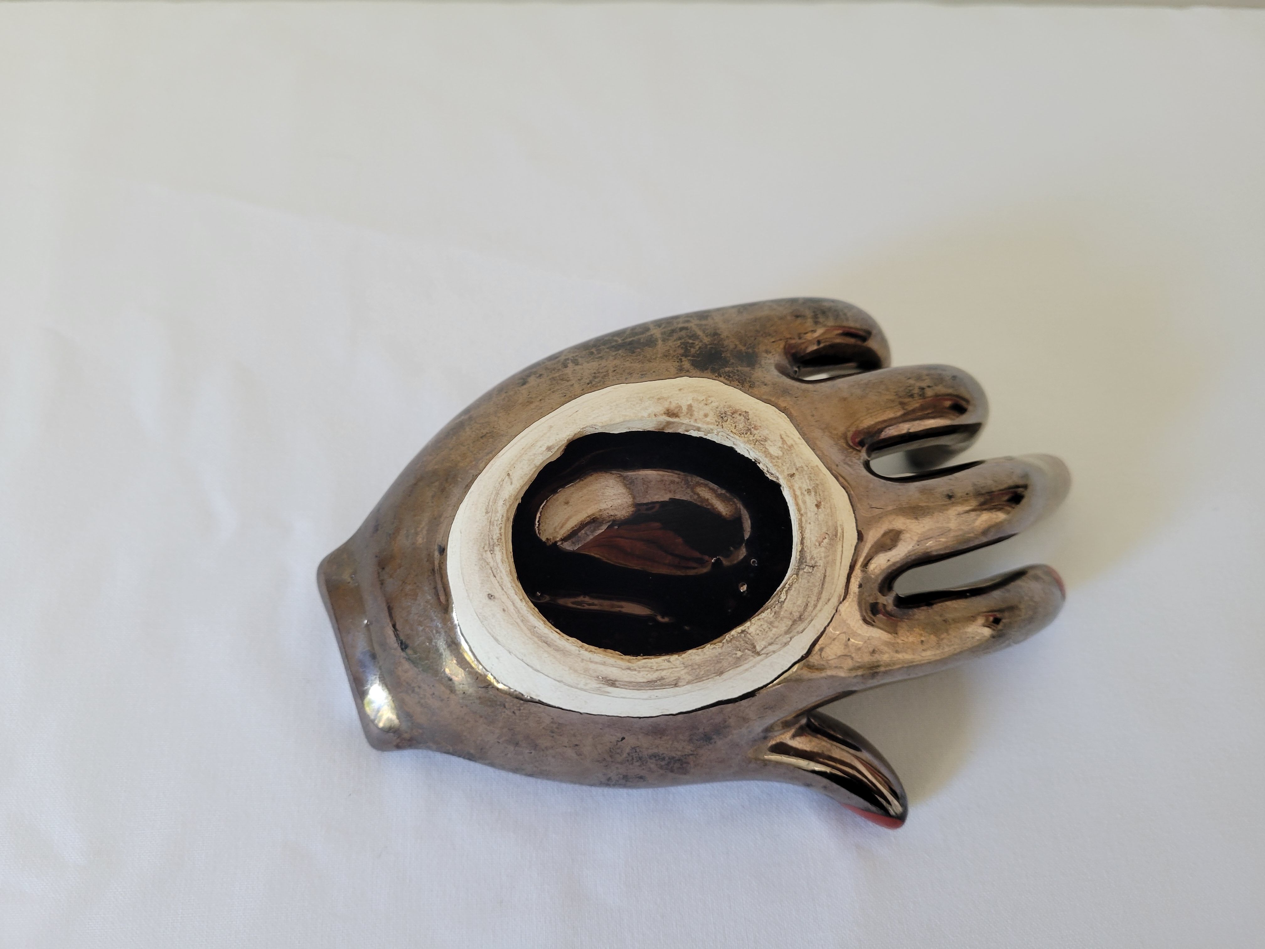 Empty pockets in the shape of a hand