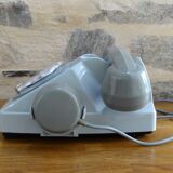 Grey vintage rotary dial phone with earpiece