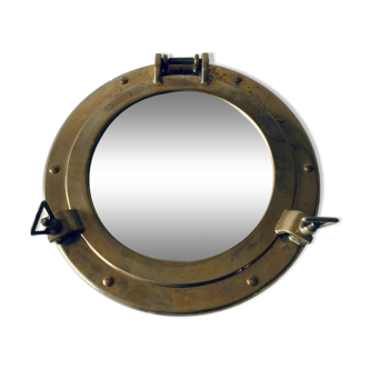 Porthole mirror in gilded brass