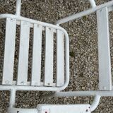 Garden furniture in wrought iron and wooden slats composed of two armchairs, 4 chairs and a table.