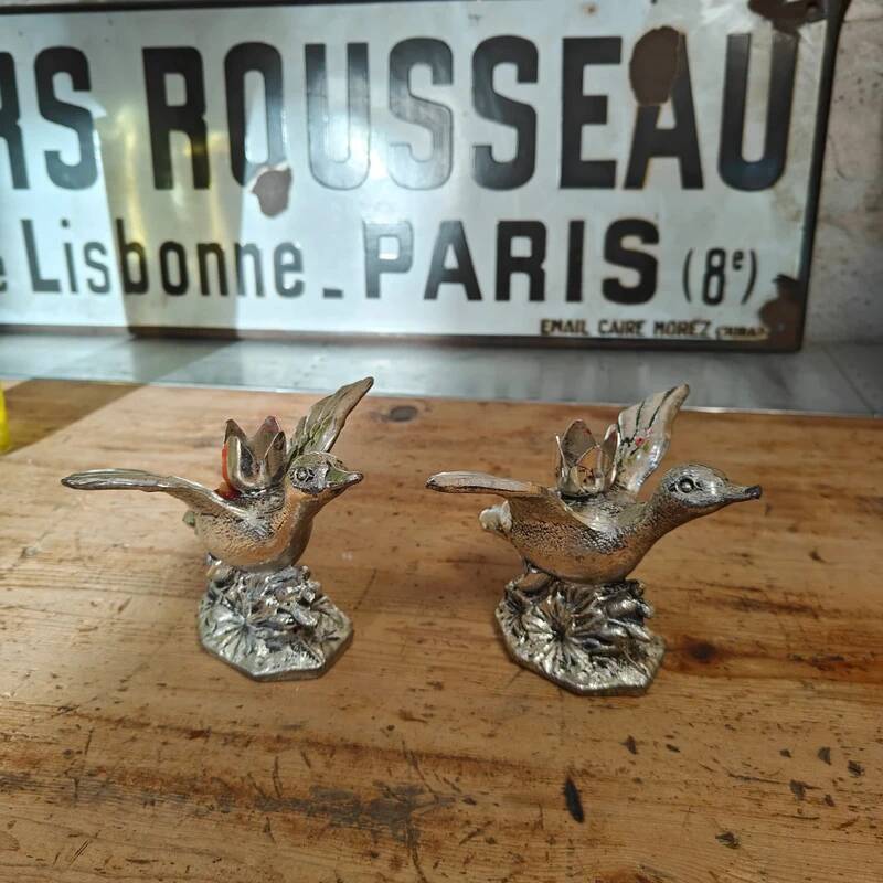 Set of two vintage silver-plated candle holders.