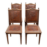 Lot de 4 chaises de style Louis XVI en bois sculpté et cuir gaufré.