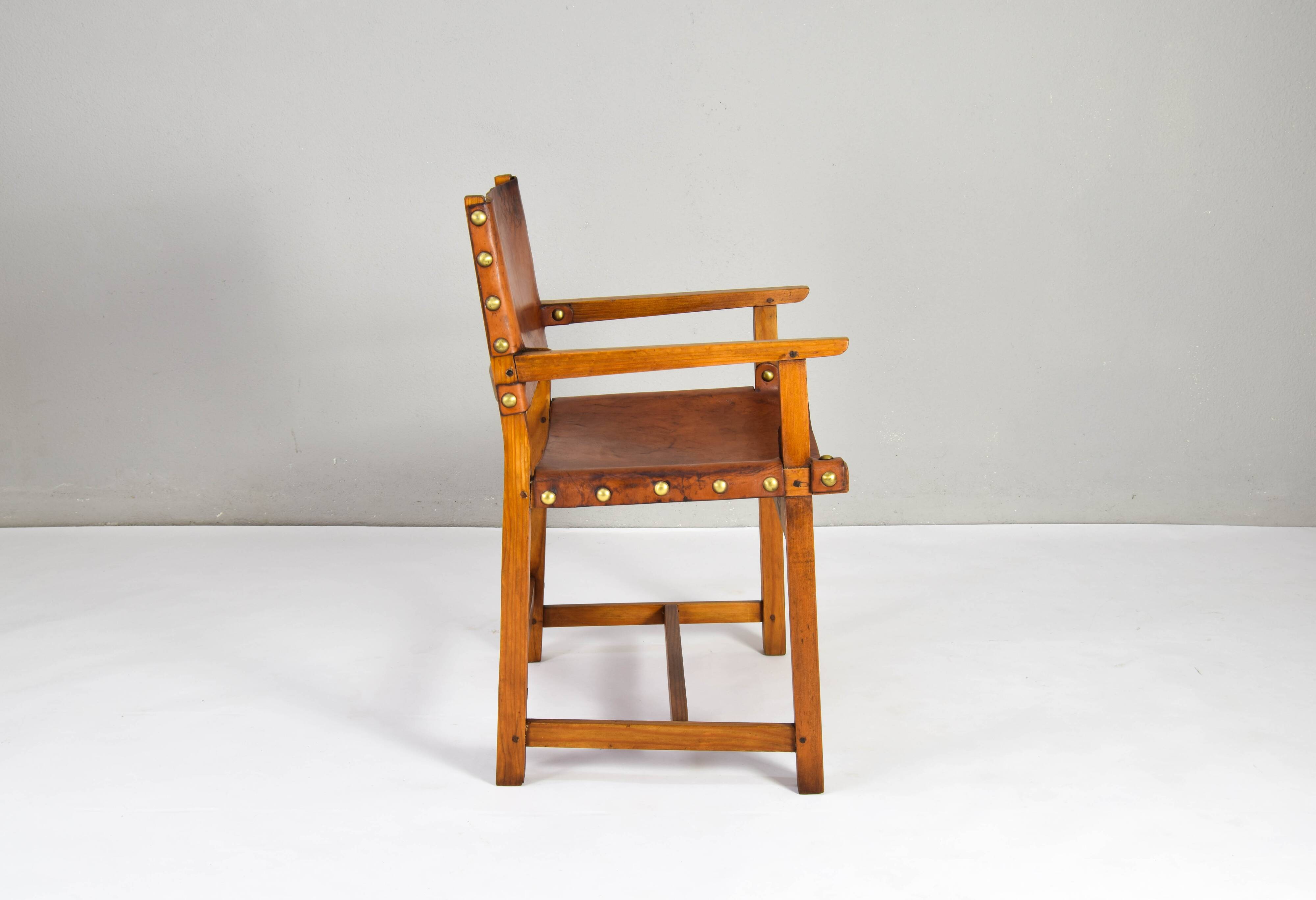 19th century oak and cognac leather brutalist castellana spanish armchair