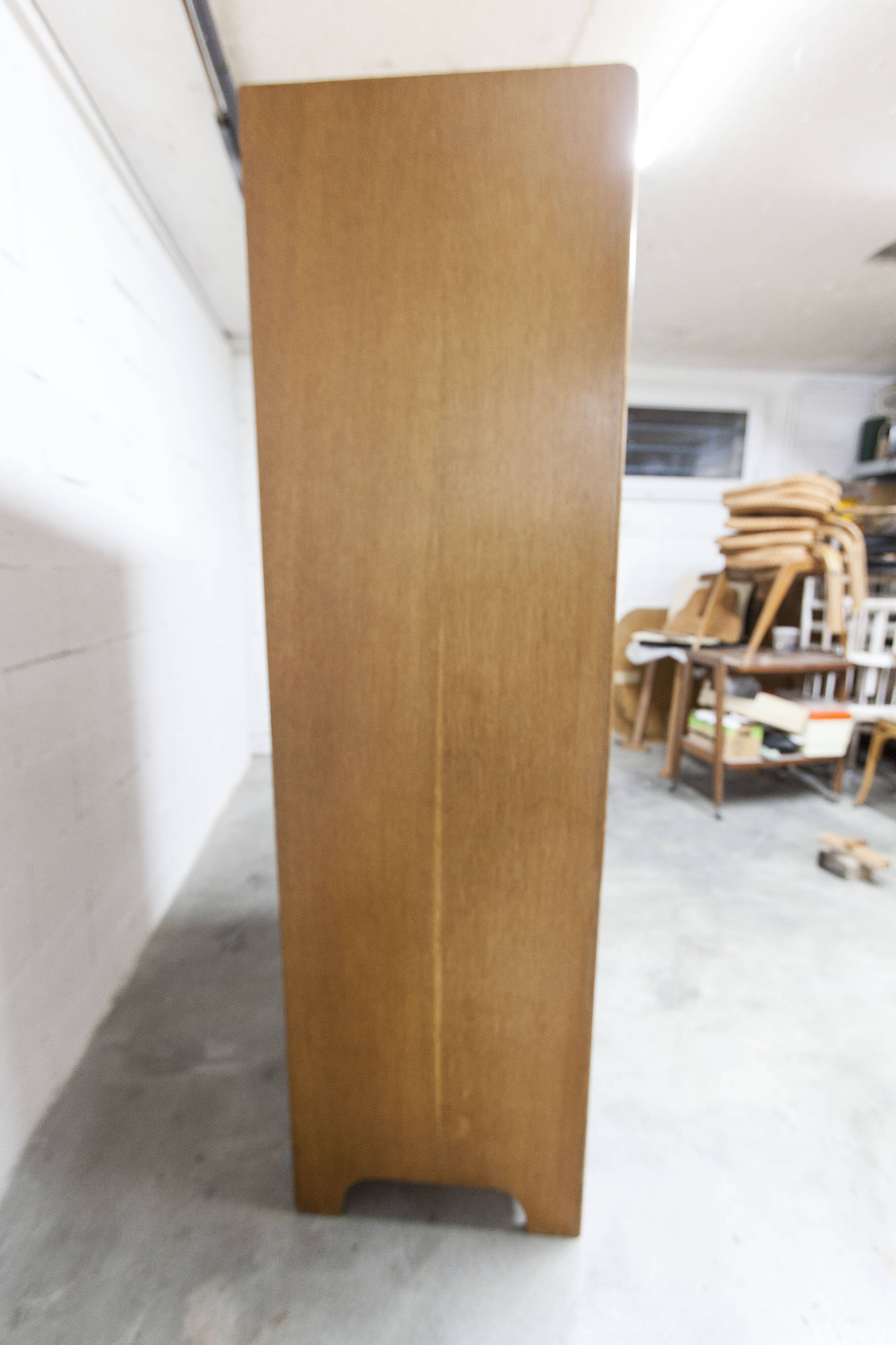 1950s Mid-Century Modern oak armoire with two doors and two drawers.