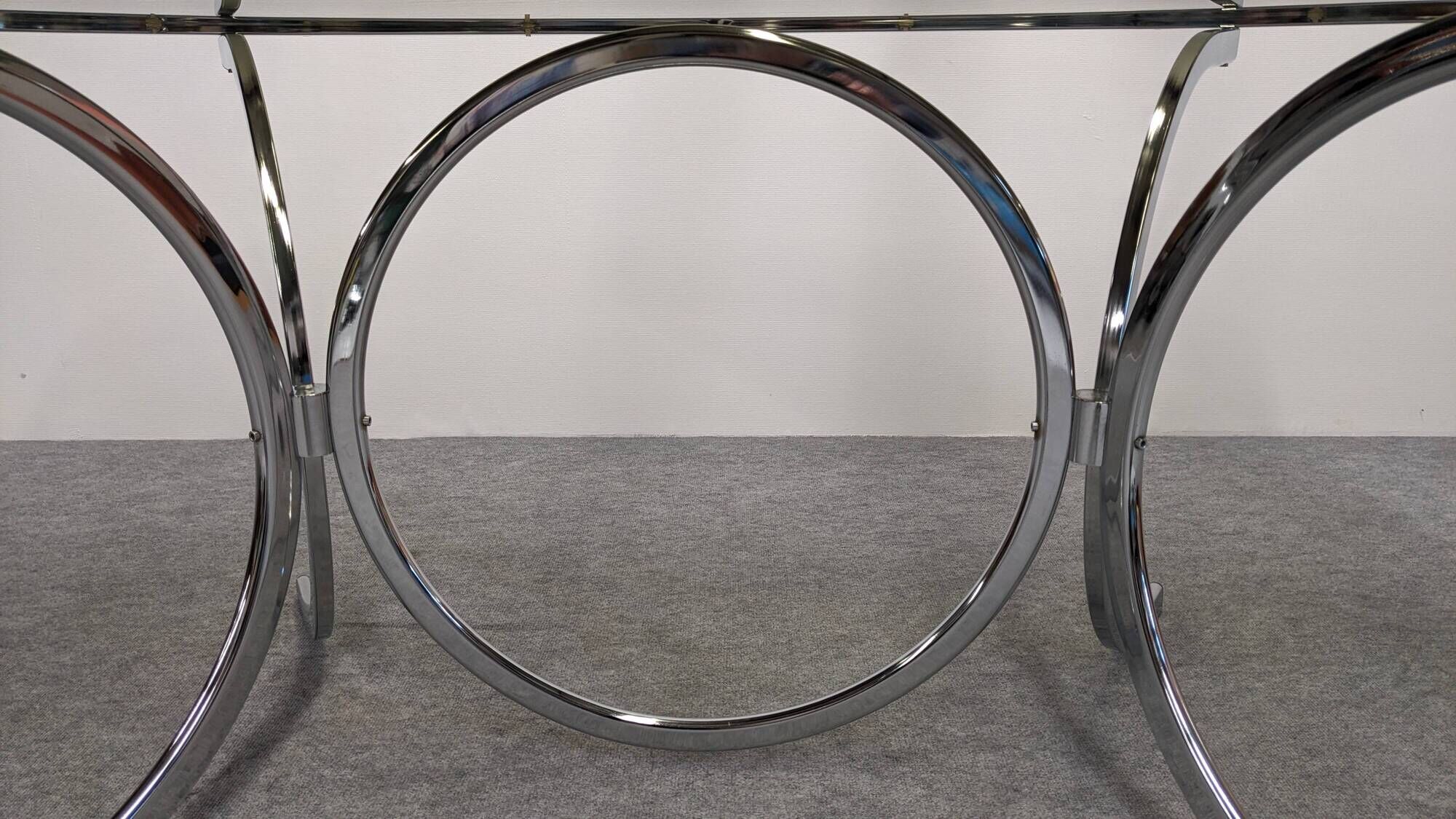 Oval dining table in chromed metal and smoked glass, Italy circa 1970