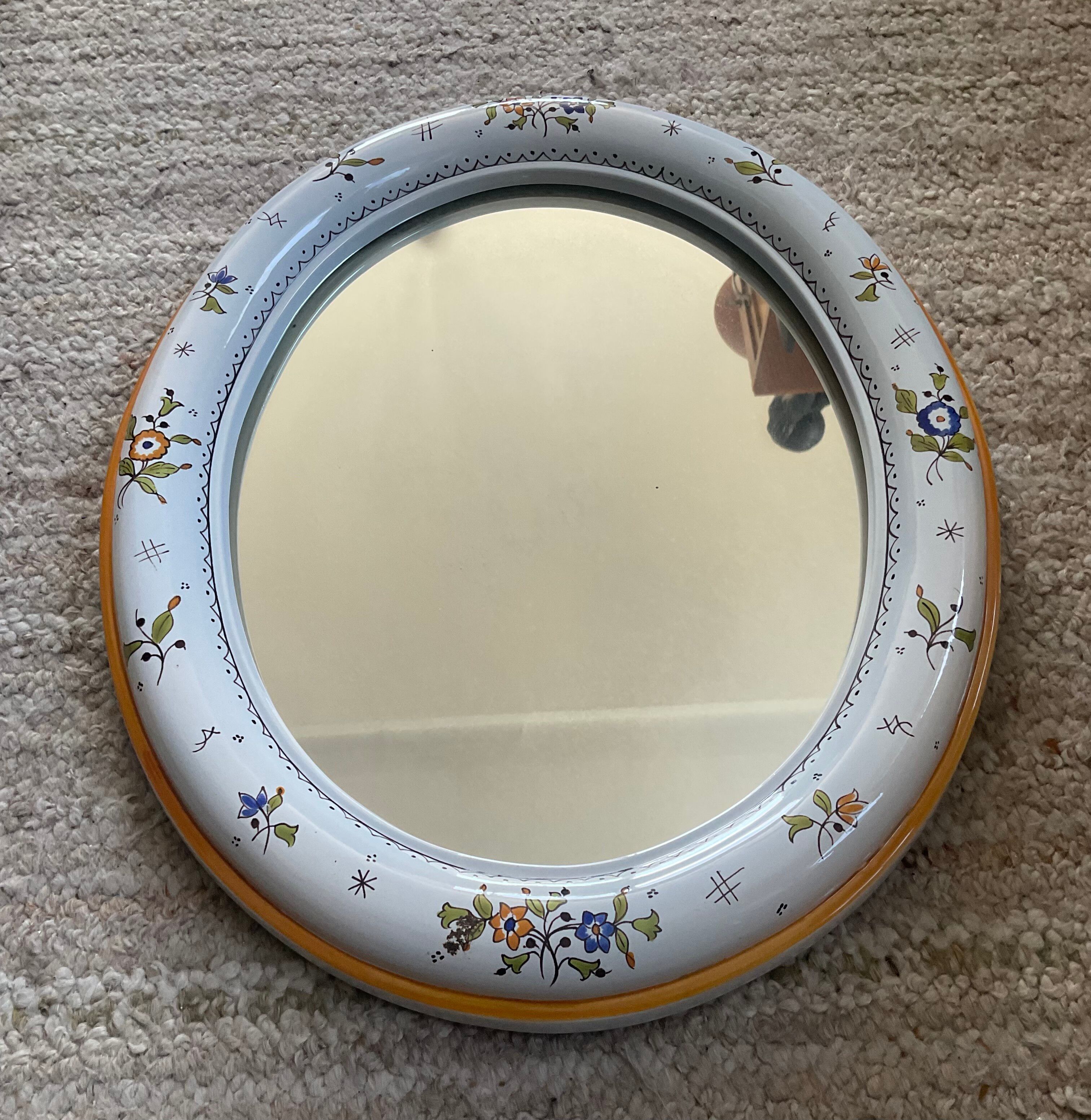 Vintage oval mirror in glazed earthenware