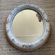 Vintage oval mirror in glazed earthenware