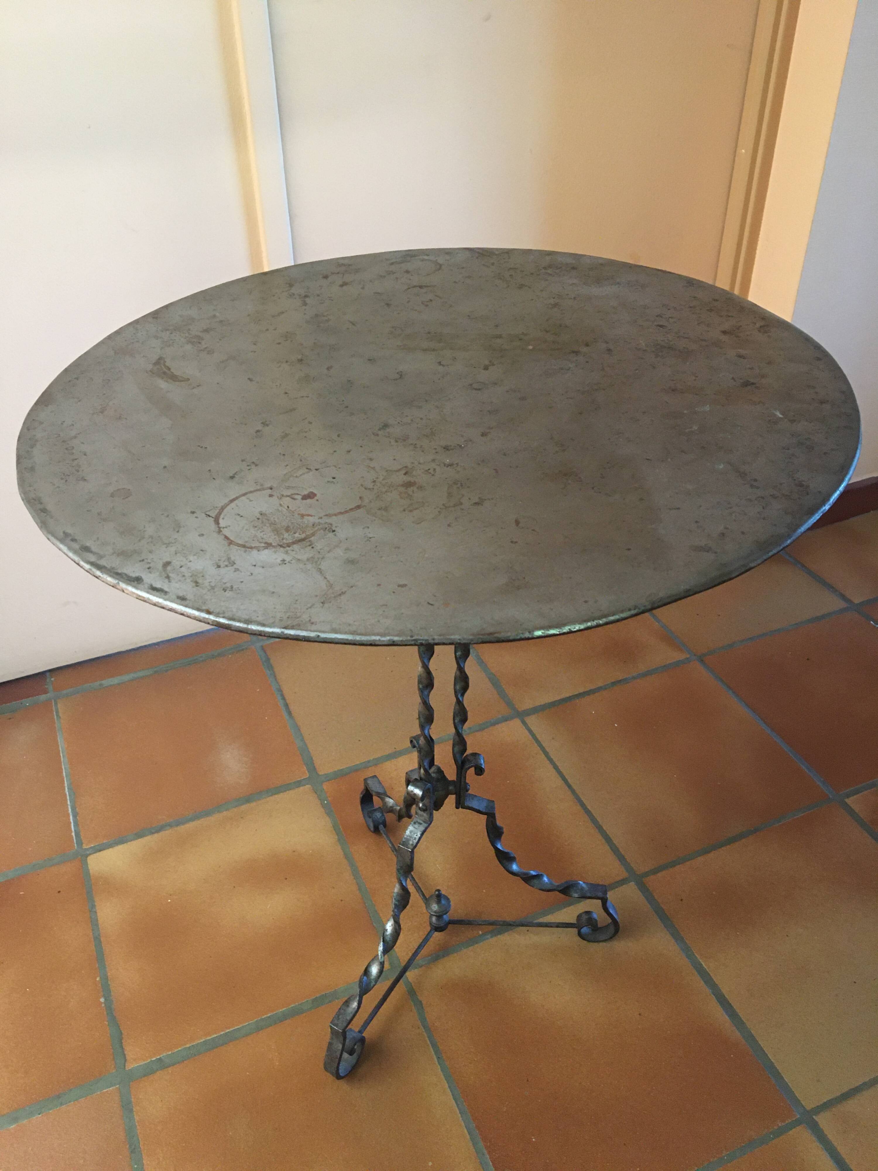 Round and antique metal side table