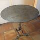 Round and antique metal side table
