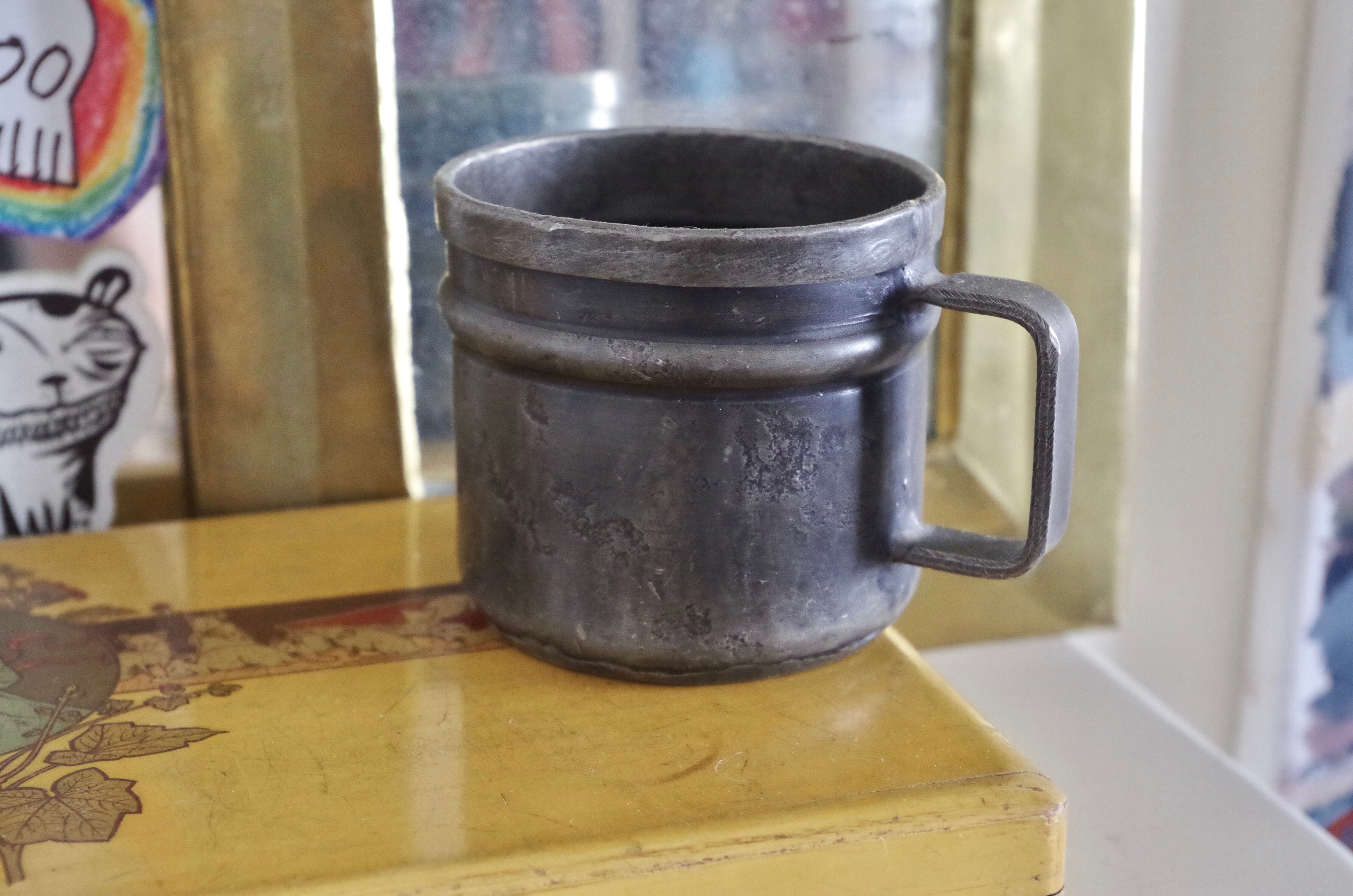 Old tin cup