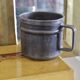 Old tin cup