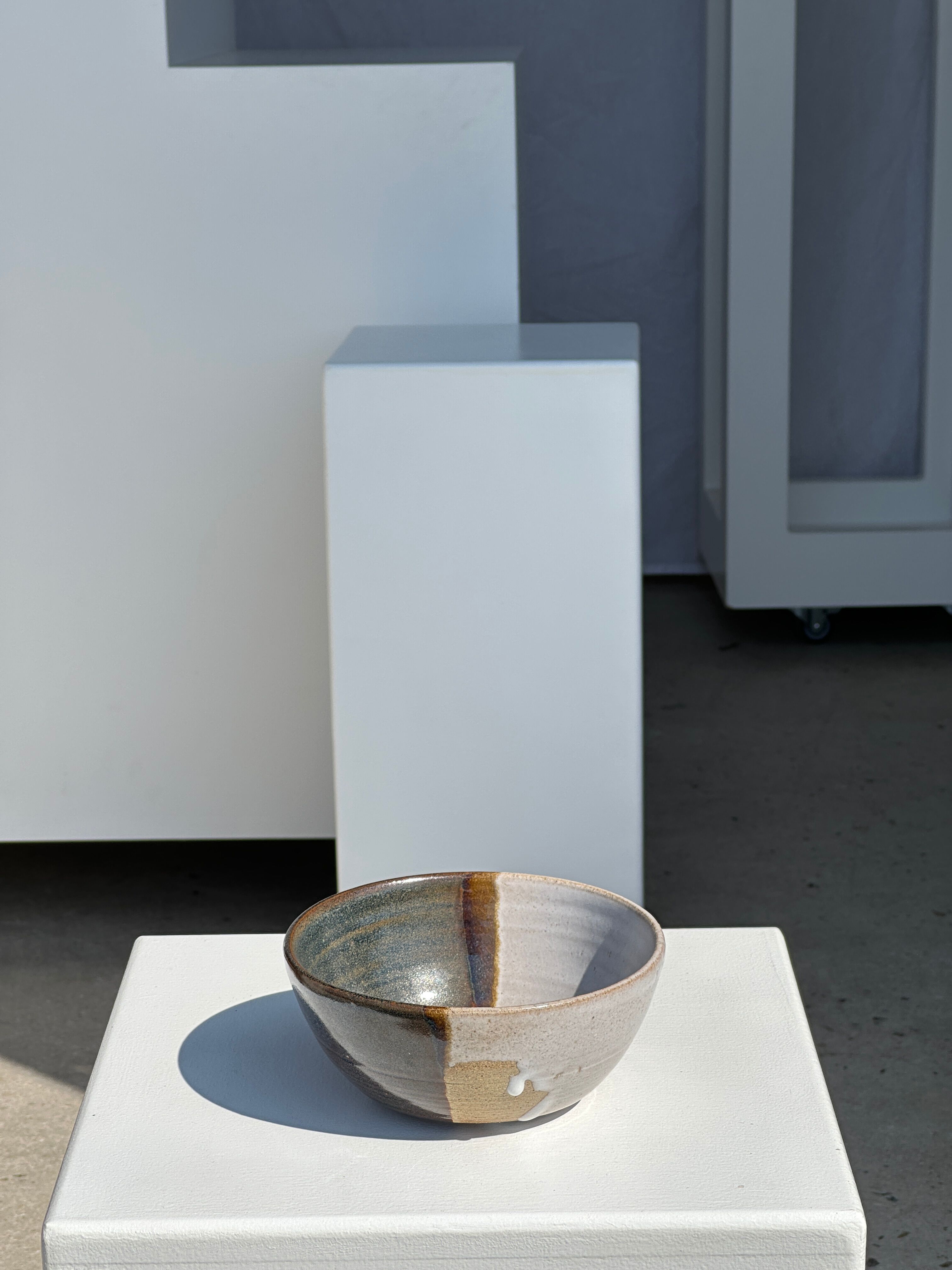 White and glossy brown two-tone ceramic bowl, matt earth