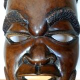 Enigmatic face of Africa carved in ebony wood