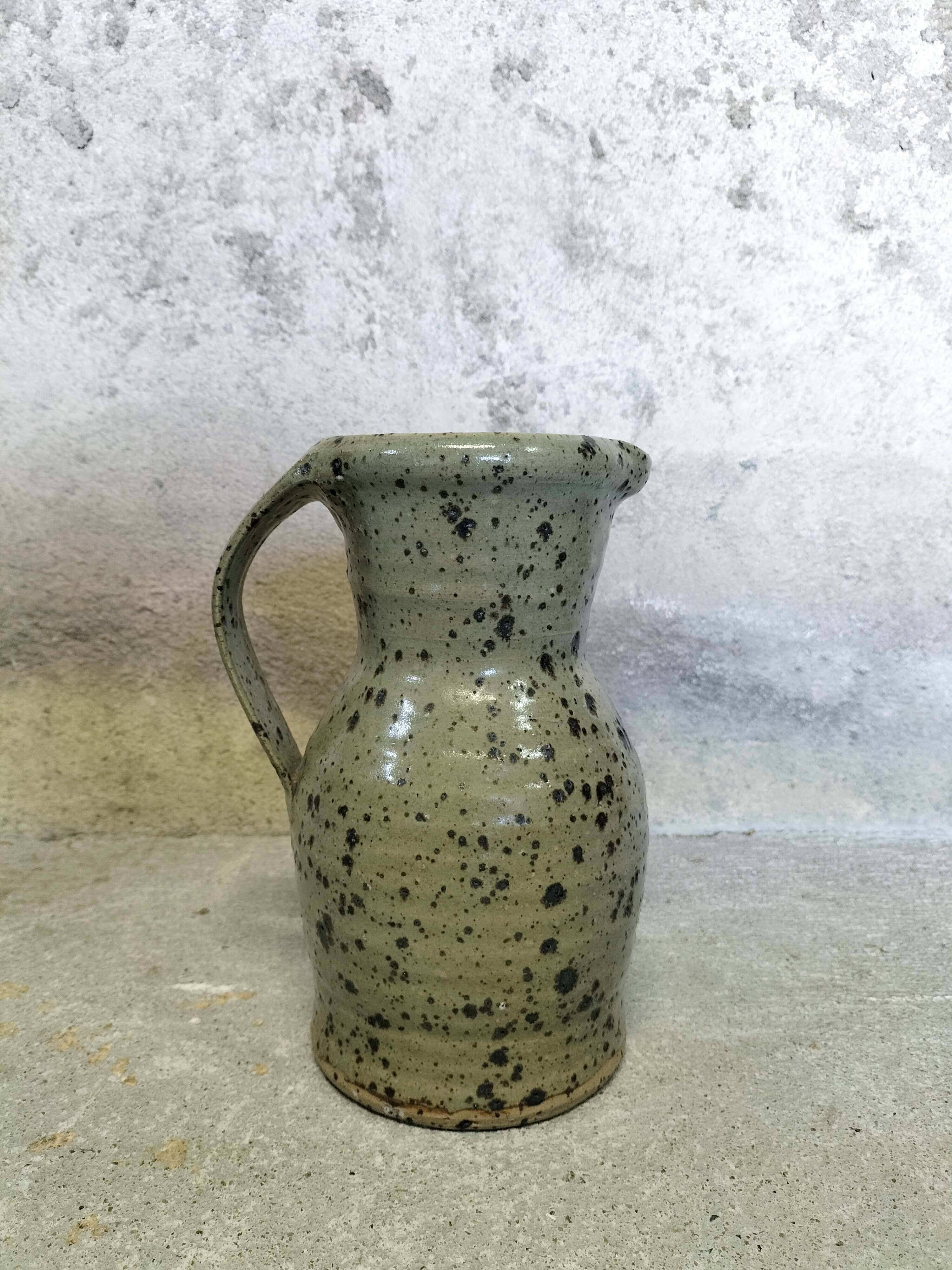 Stoneware pitcher by Gustave Tiffoche
