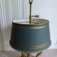 Golden bronze hot water lamp and tin lampshade