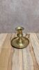 Antique brass candlestick with pusher