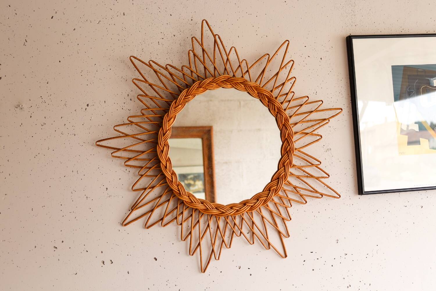 Vintage sun mirror in woven rattan
