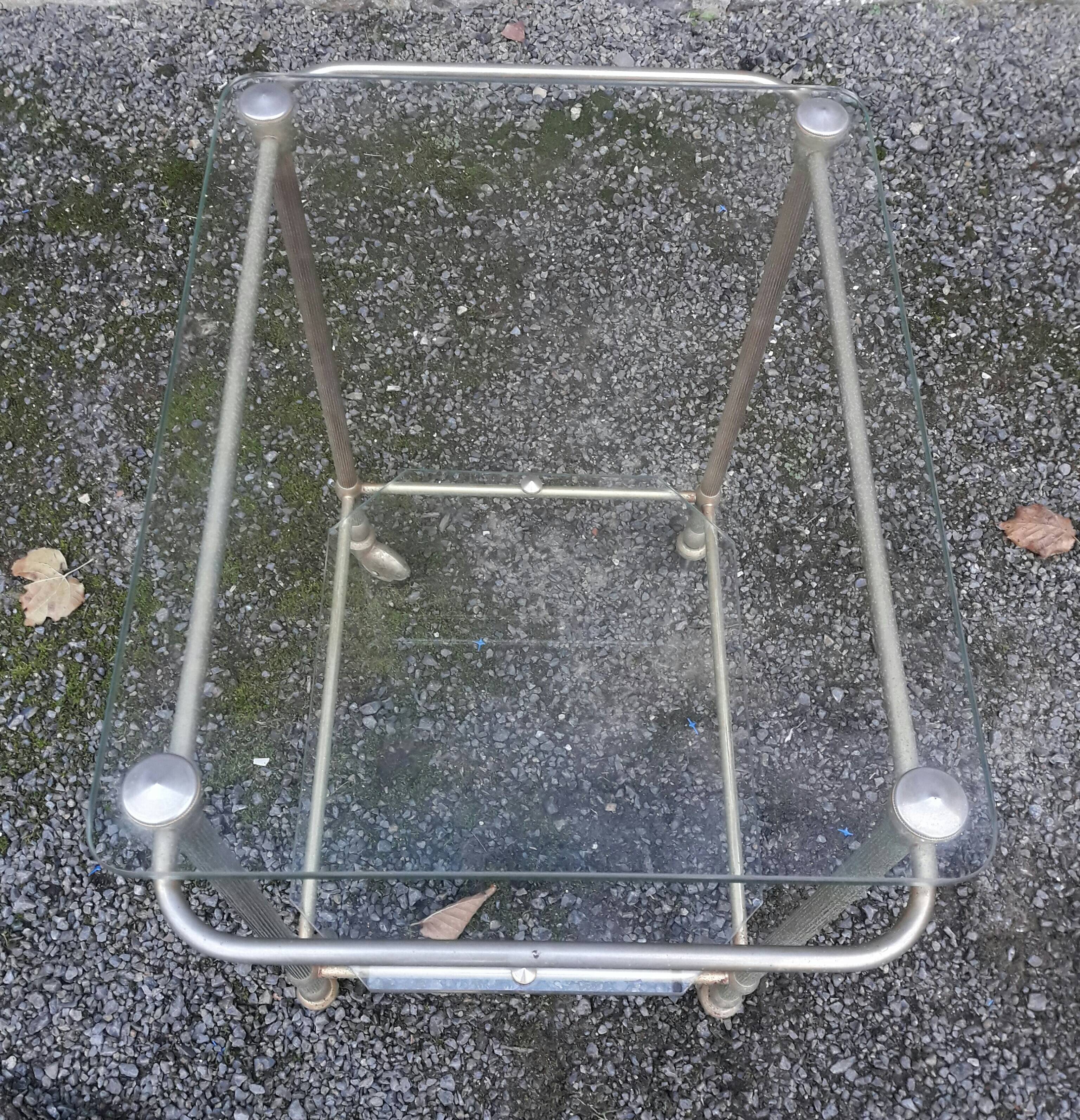 Small rolling table in glass and gold metal