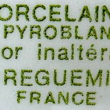 Suite of twelve (12) hotel-grade porcelain table plates