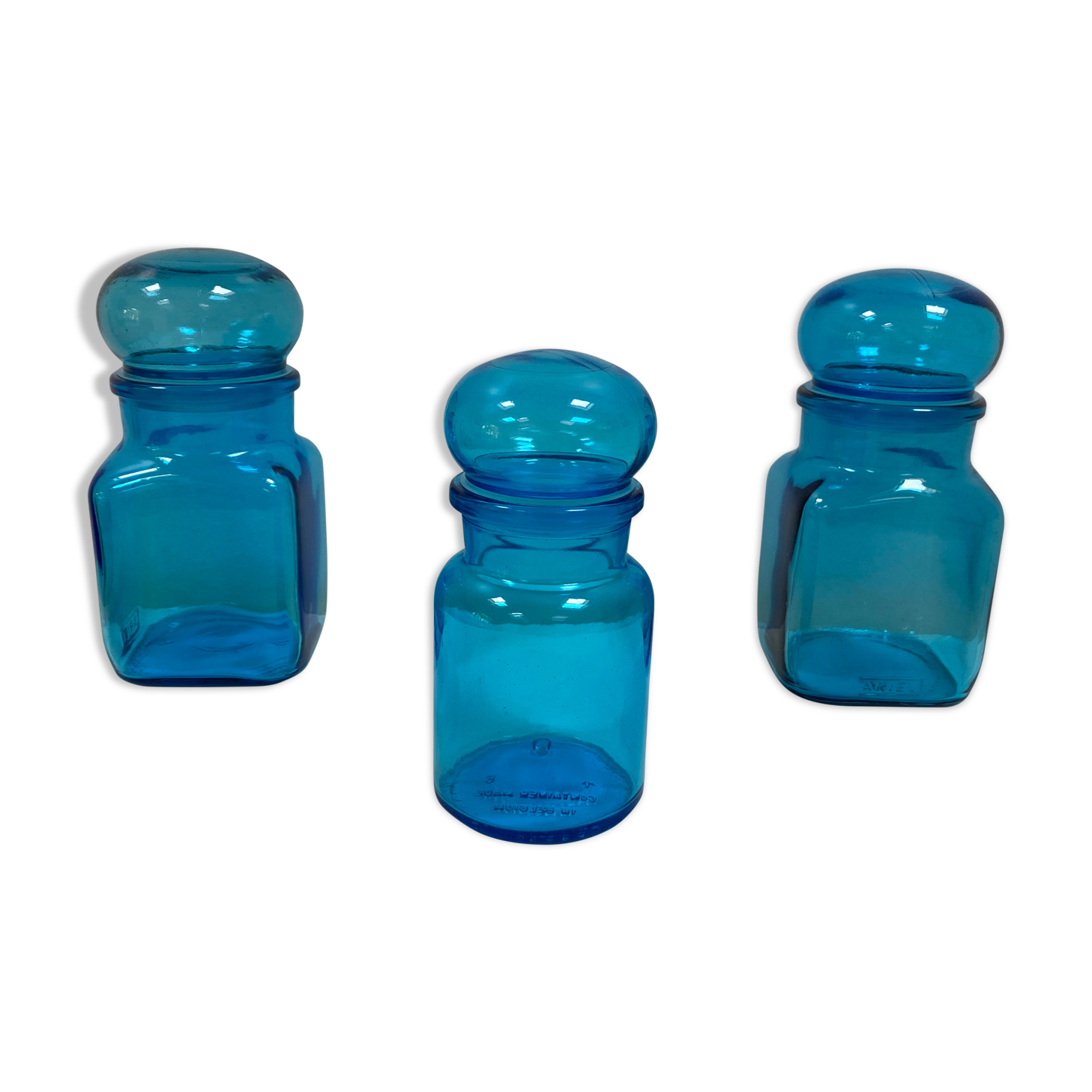 Trio of vintage turquoise blue glass jars