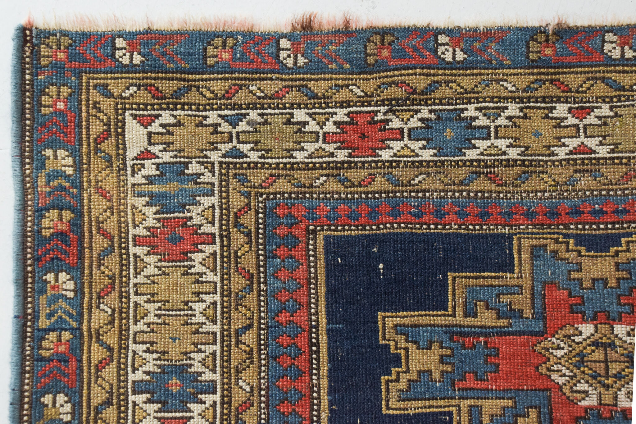 Handwoven blue ground persian rug with bird-like figures