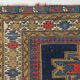Handwoven blue ground persian rug with bird-like figures