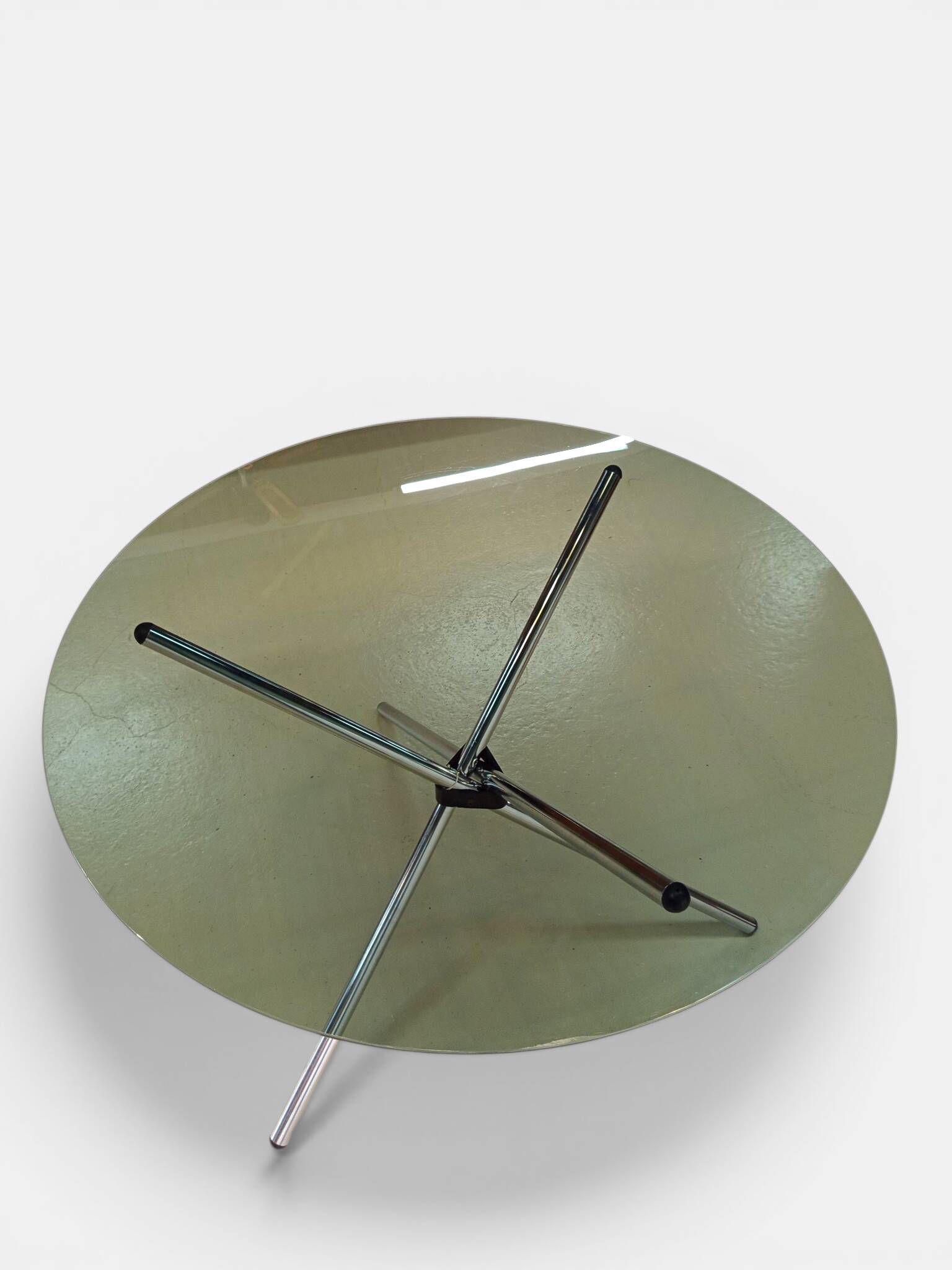 Vintage round table with smoked glass and foldable chrome legs.
