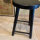 Black wooden stool