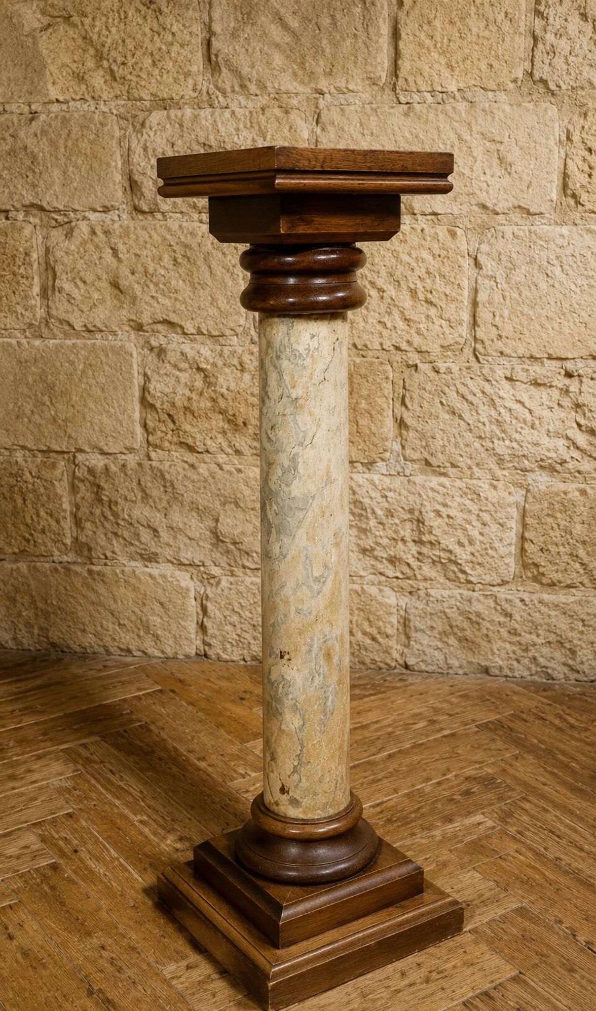 Wood and lacquer pedestal column table mimicking marble, 19th century.