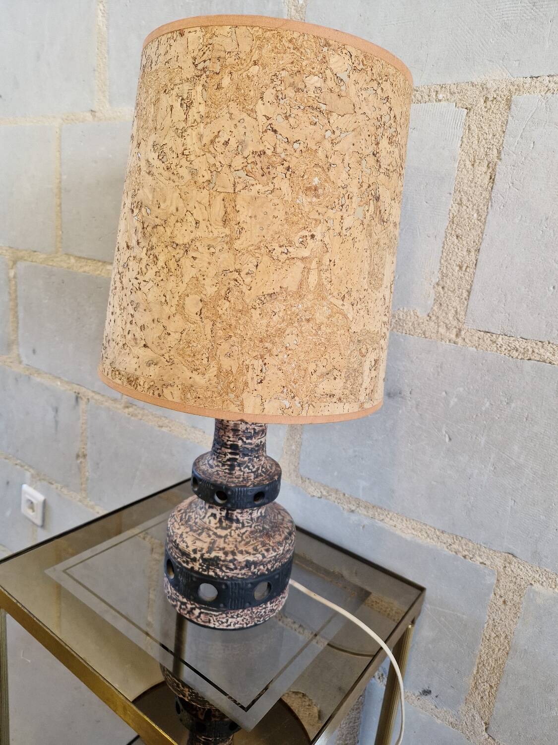 Ceramic lamp with openwork design and double lighting