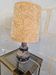 Ceramic lamp with openwork design and double lighting