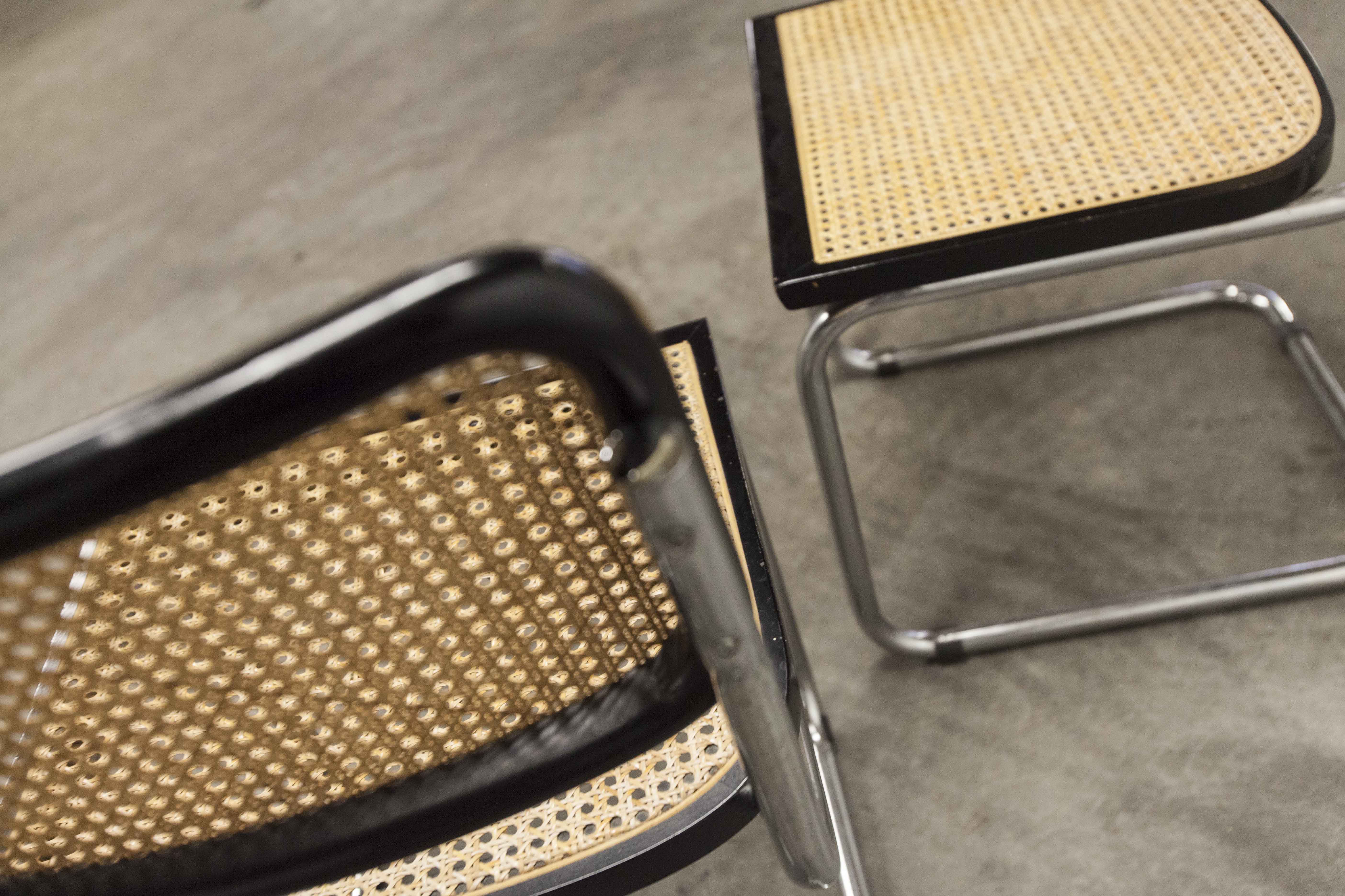 Pair of black Breuer b32 chairs and cannage