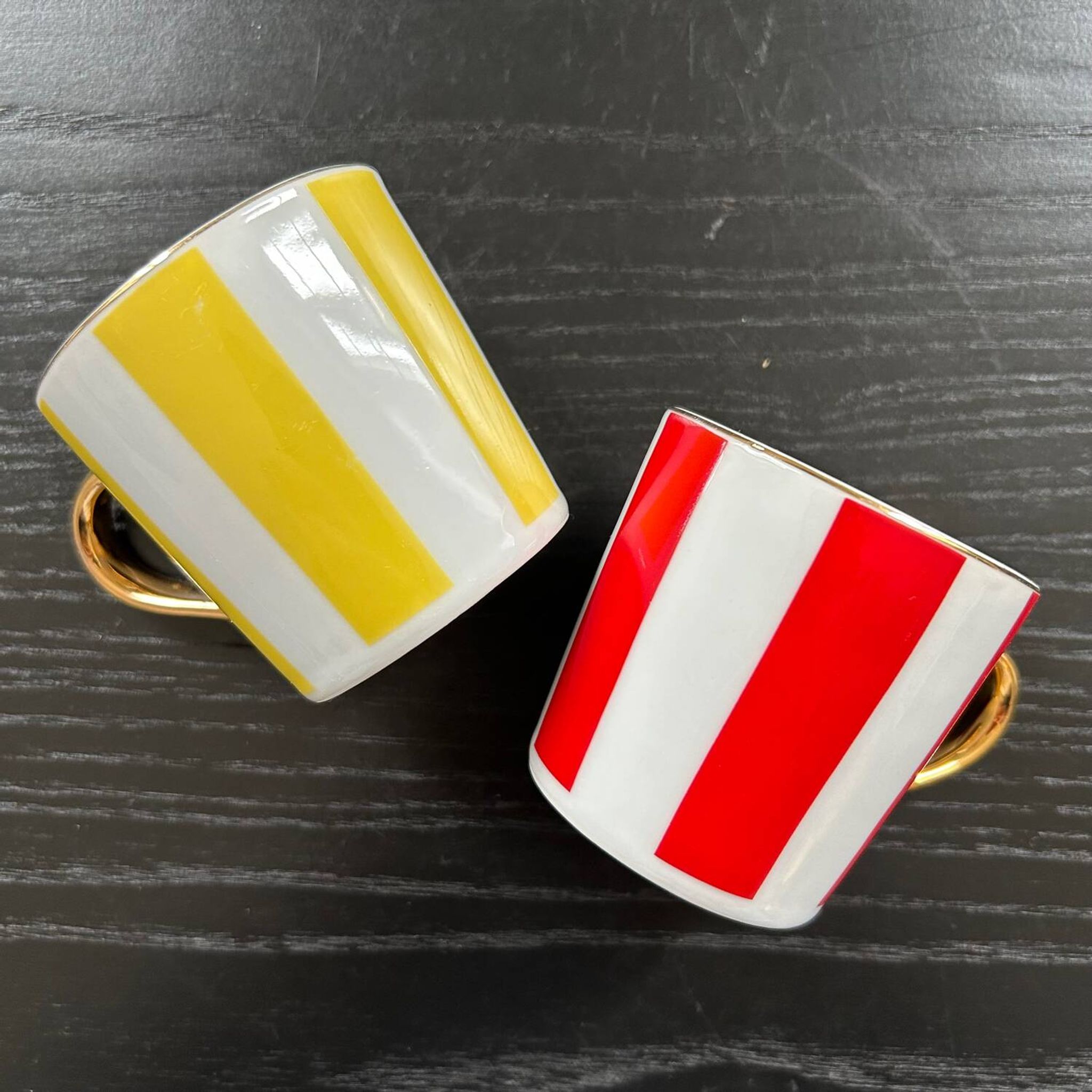 Pair of red and yellow striped cups