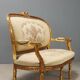 Neoclassical canapé in gilded wood
