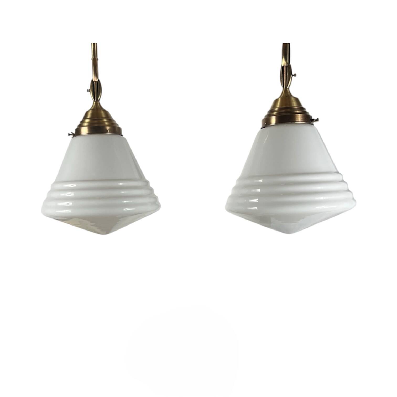 Pair of opaline glass pendant lights in white by Philips and brass from the 1920s.